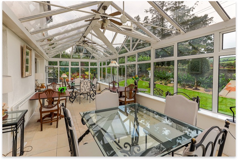 Bright conservatory overlooking the garden